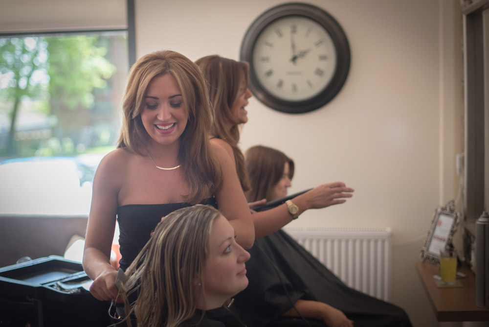 Stylists finishing a client's colour
